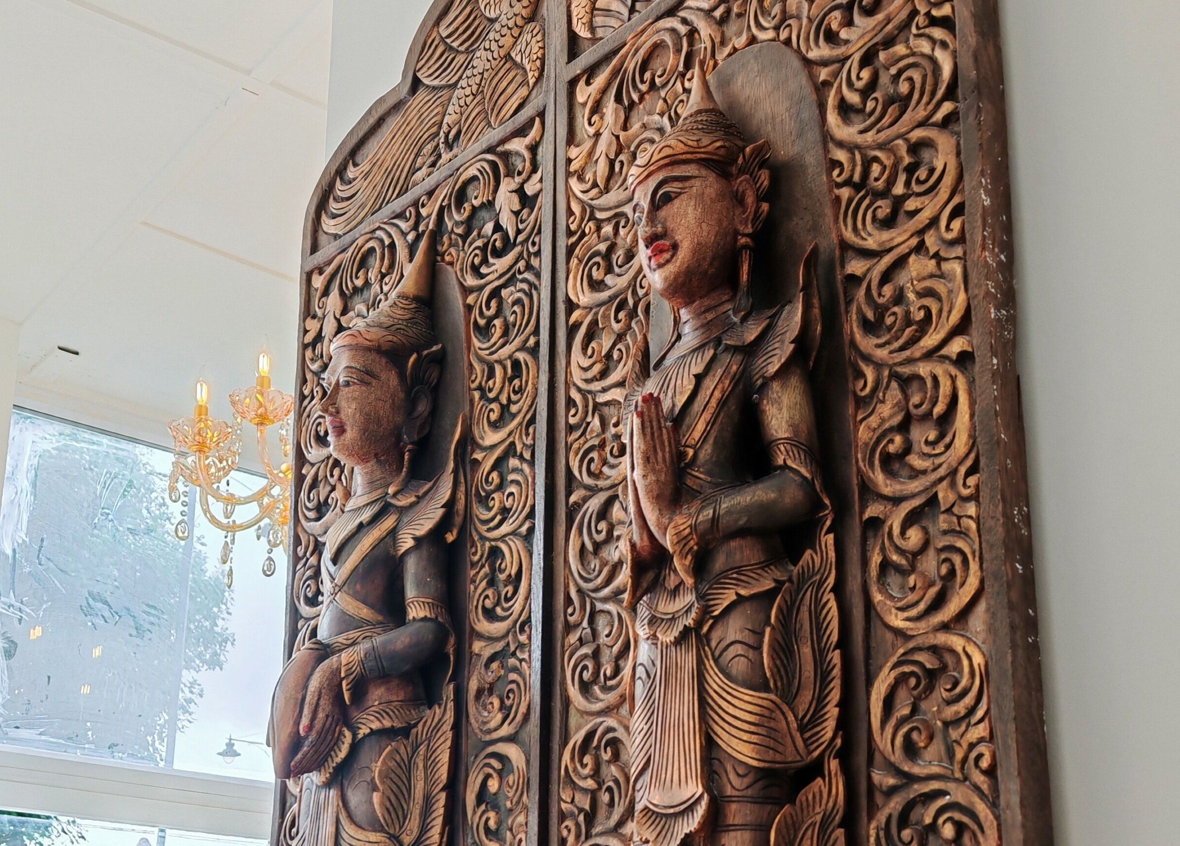 Intricate wooden carvings at The Andaman Sanctuary, Twickenham, England, GB, enhancing a tranquil atmosphere.