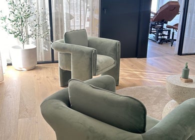 Serene lounge seating at Cosmetic Club, Melbourne, Victoria, AU featuring plush chairs and natural decor.