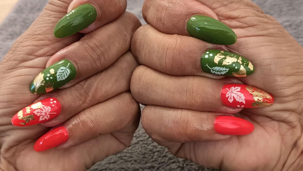 Colorful festive nail art at Classic Nail & Lash Studio, Cape Town, Western Cape, ZA, showcasing intricate floral design.