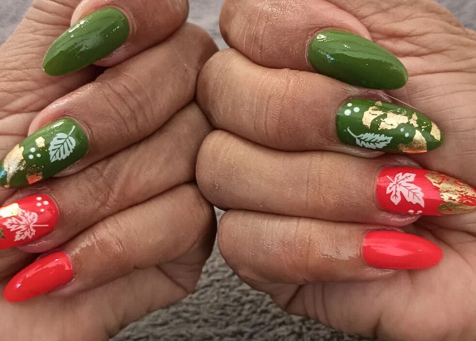 Colorful festive nail art at Classic Nail & Lash Studio, Cape Town, Western Cape, ZA, showcasing intricate floral design.