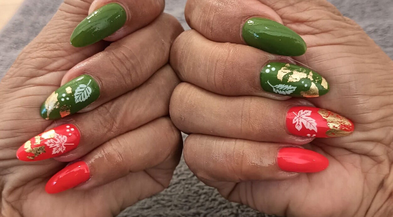 Colorful festive nail art at Classic Nail & Lash Studio, Cape Town, Western Cape, ZA, showcasing intricate floral design.