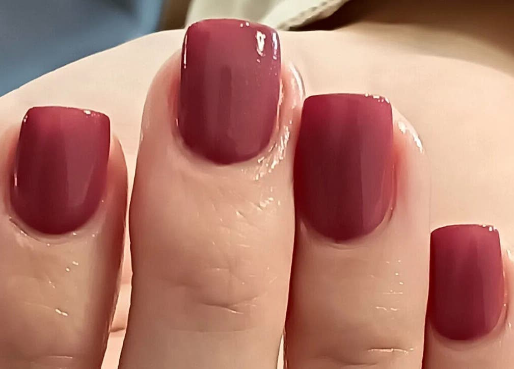 Maroon manicured nails at Classic Nail & Lash Studio, Cape Town, Western Cape, ZA for a chic look.