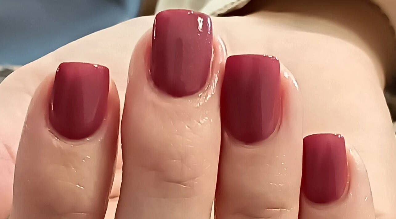 Maroon manicured nails at Classic Nail & Lash Studio, Cape Town, Western Cape, ZA for a chic look.