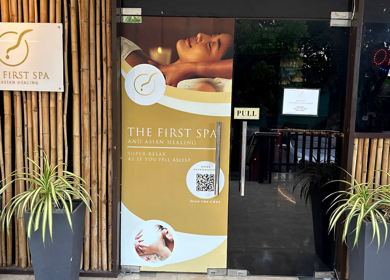 Entrance of The FIRST Spa in Cebu City, Central Visayas, PH with bamboo decor and inviting sign.