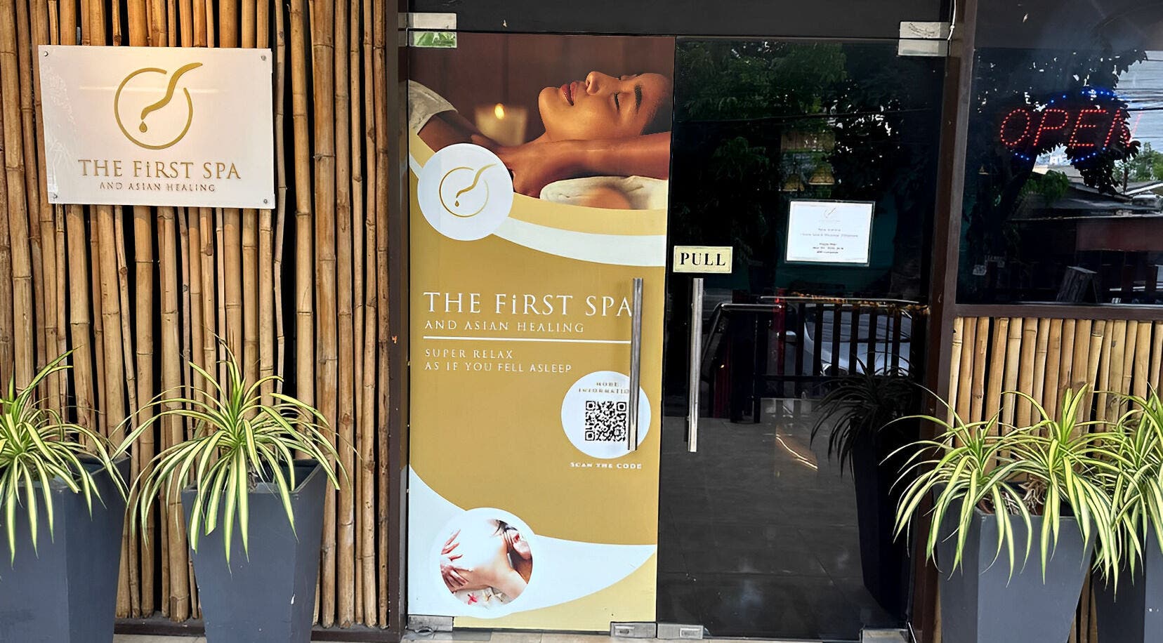 Entrance of The FIRST Spa in Cebu City, Central Visayas, PH with bamboo decor and inviting sign.