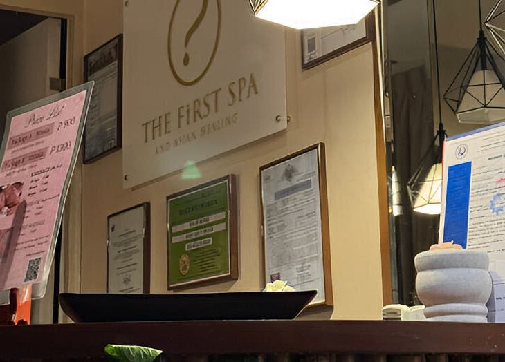 Reception area at The FIRST Spa, Cebu City, Central Visayas, PH, with certificates and pastel decor.