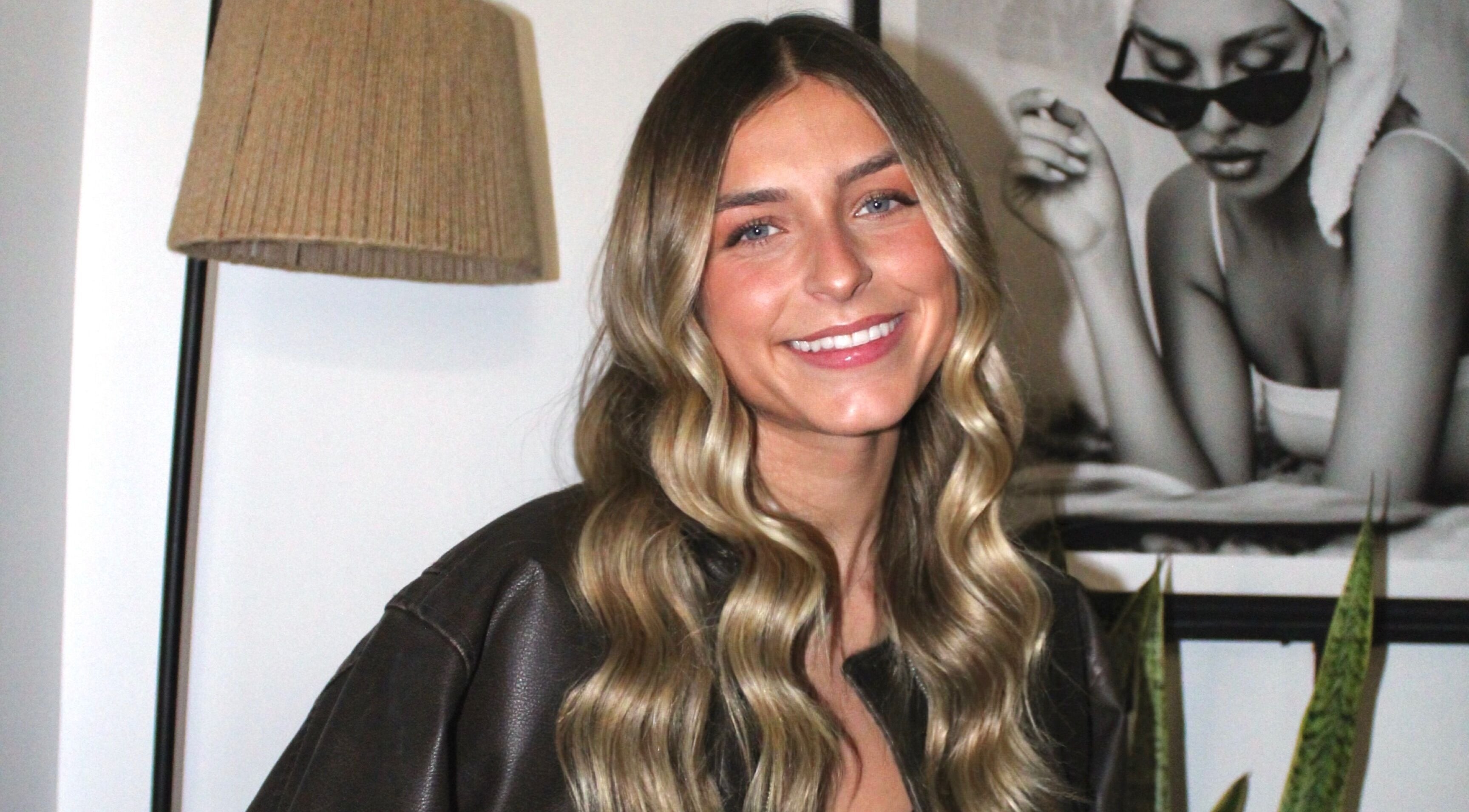 A smiling woman with styled hair at Mya Marie Esthetics, Milford, Michigan, US.