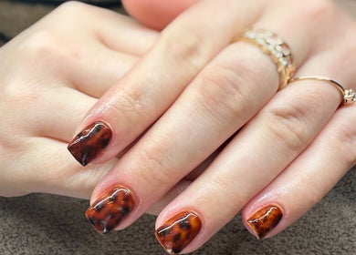 Stylish tortoise shell nails at HB Beauty Bar, Houghton Regis, England, GB, showcasing exquisite detail.