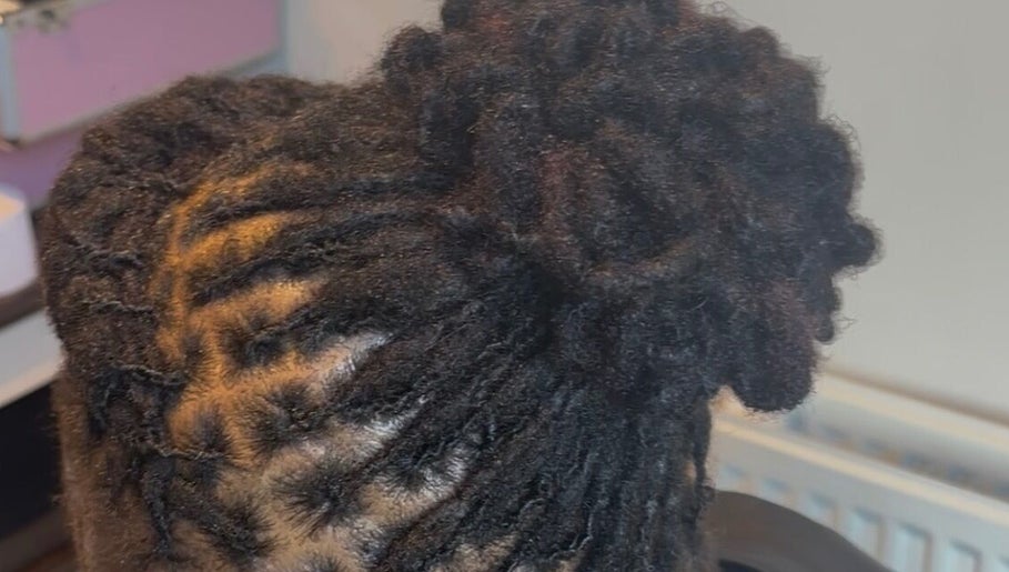 Expertly styled locs at The Loc Station in Bathgate, Scotland, GB, showcasing intricate hair artistry.