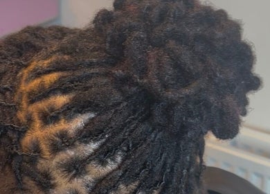 Expertly styled locs at The Loc Station in Bathgate, Scotland, GB, showcasing intricate hair artistry.