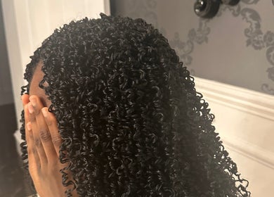 Stylish black curls at The Loc Station, Bathgate, Scotland, GB, showcasing exquisite hair artistry.