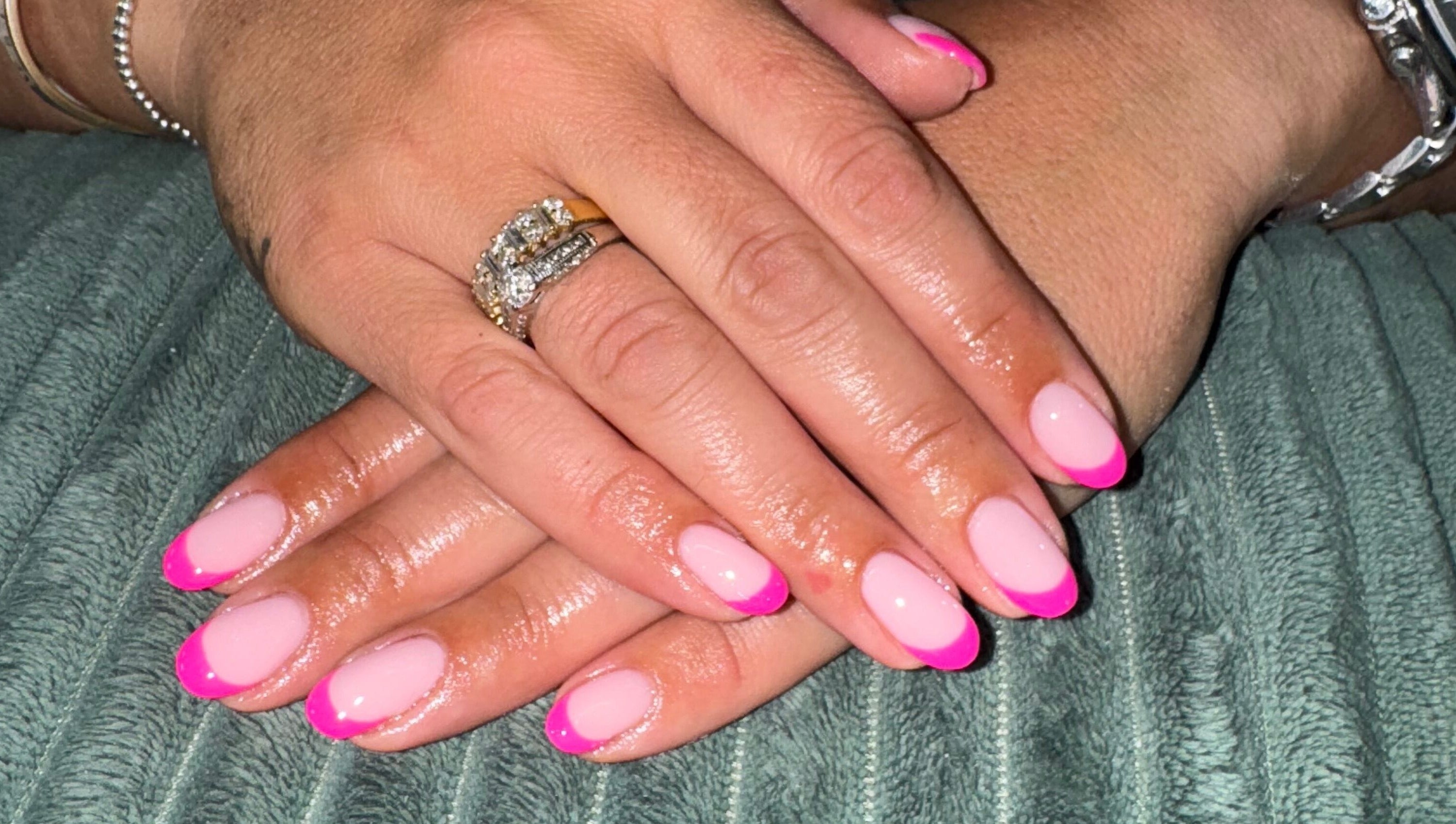 Close-up of elegant pink French manicure by Your Nail Tech Anna Jones in Middle Rasen, England, GB.