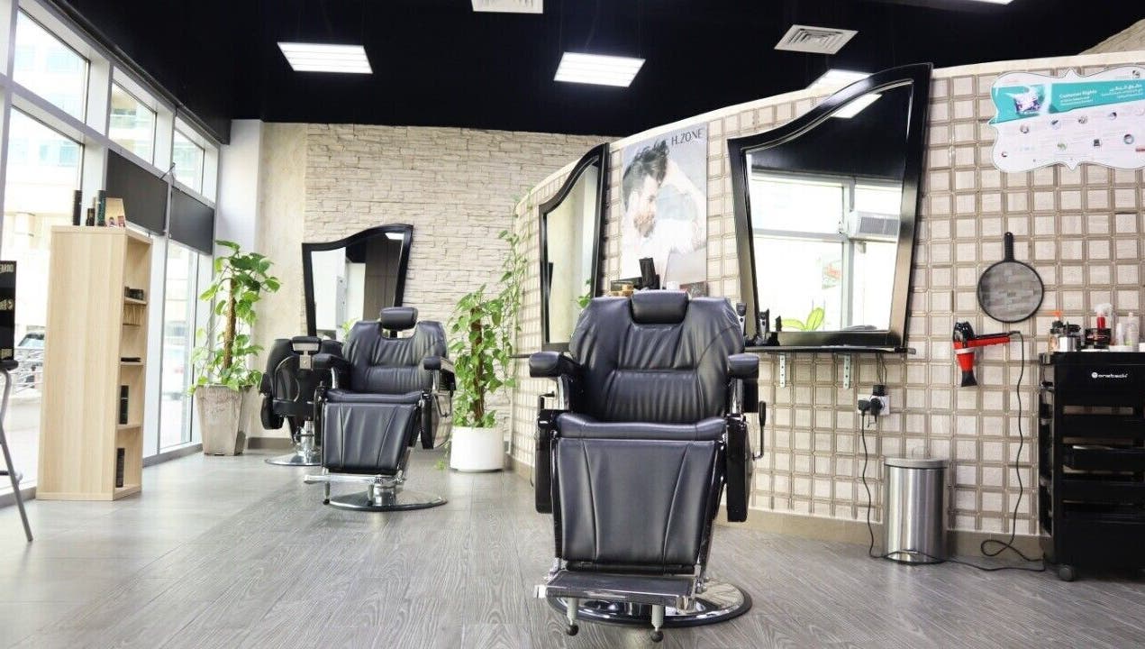 Elegant barber chairs at Sumr Gents Saloon, Dubai, Dubai, AE showcasing luxury and comfort.