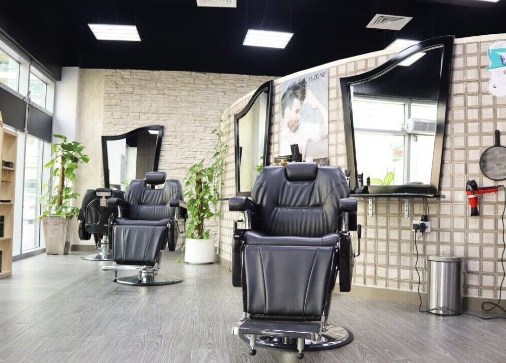 Elegant barber chairs at Sumr Gents Saloon, Dubai, Dubai, AE showcasing luxury and comfort.