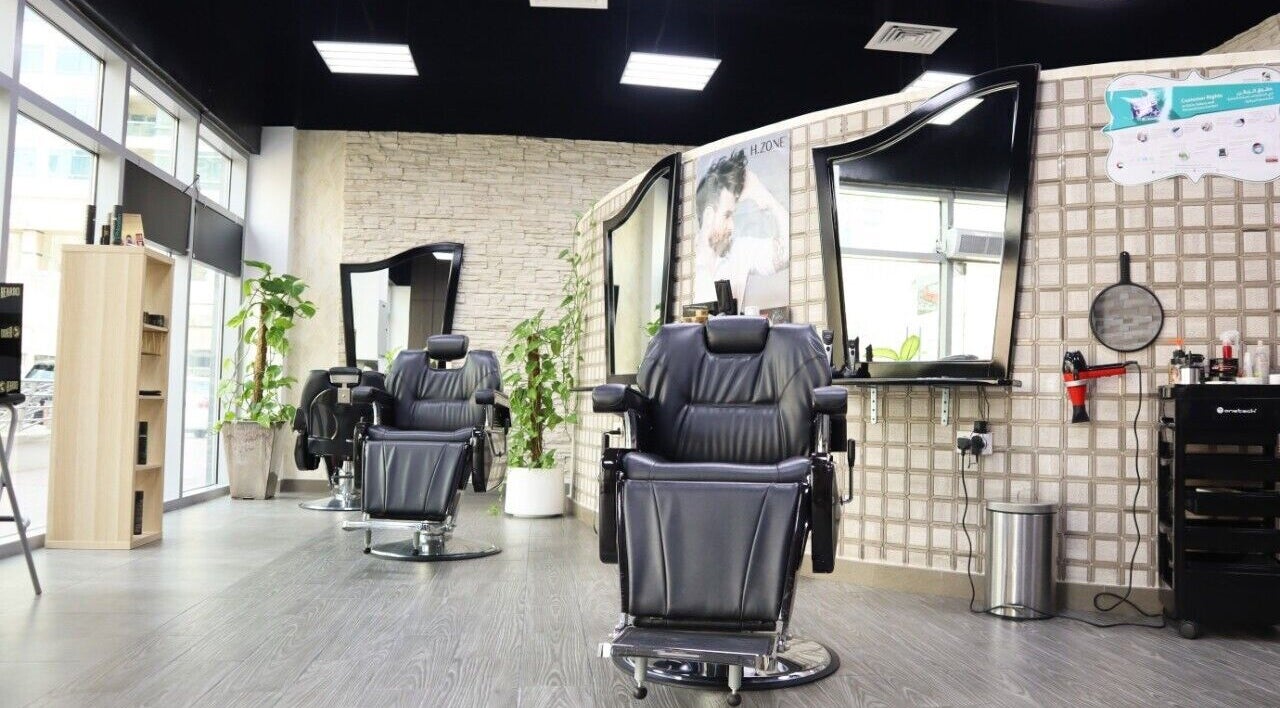 Elegant barber chairs at Sumr Gents Saloon, Dubai, Dubai, AE showcasing luxury and comfort.