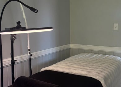 Comfortable massage bed setup at Enchanted Beautique, Coopers Plains, Queensland, AU, enhancing relaxation.