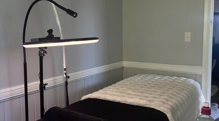 Comfortable massage bed setup at Enchanted Beautique, Coopers Plains, Queensland, AU, enhancing relaxation.