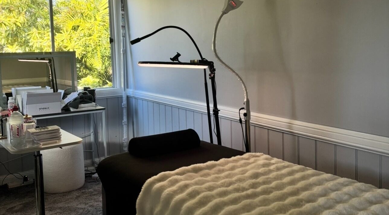 Cozy treatment room at Enchanted Beautique - Coopers Plains 📍, Queensland, AU with soft lighting and modern decor.