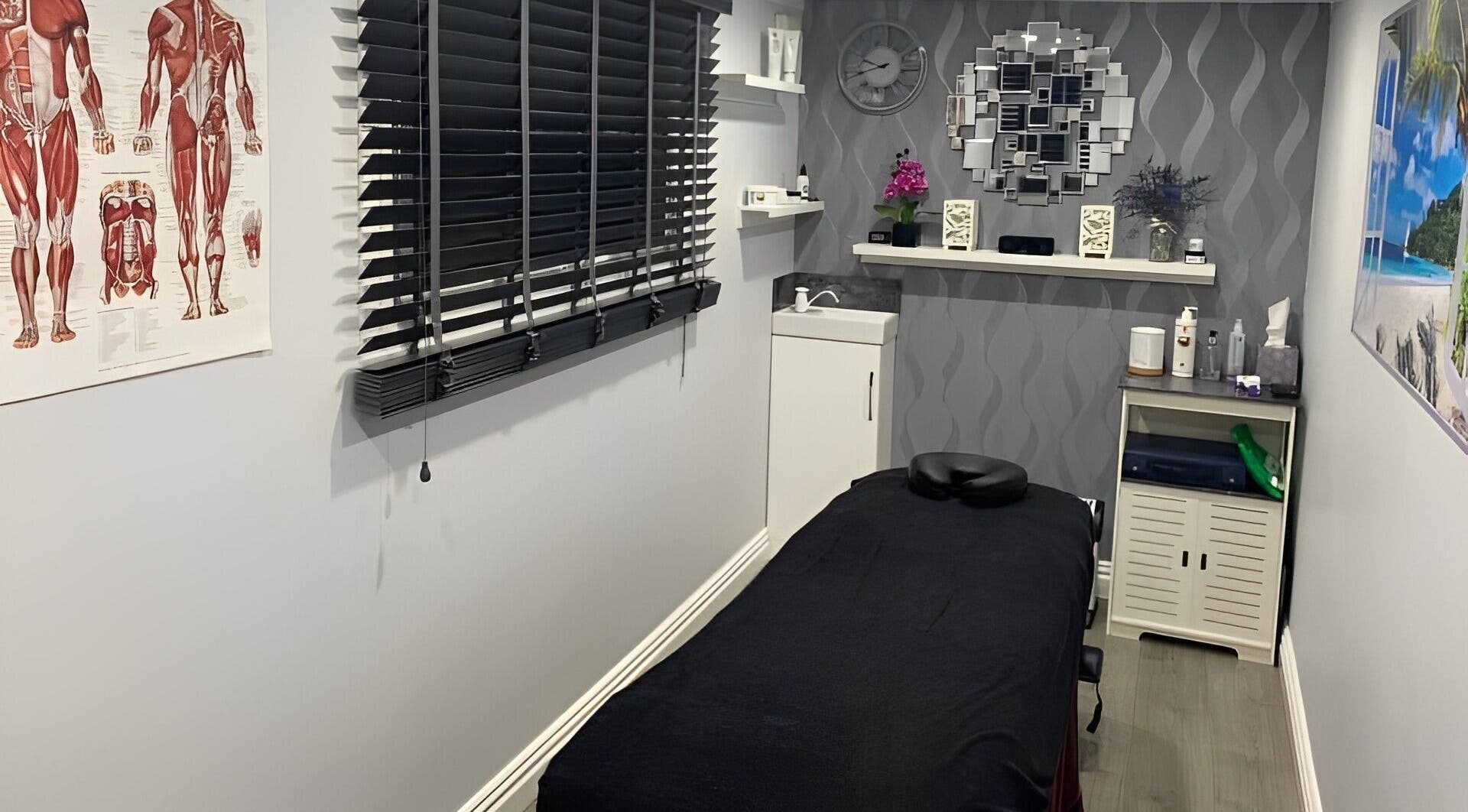 Peaceful massage room at J.F Muscle Medic, Stourbridge, England, GB with modern decor and treatment table.