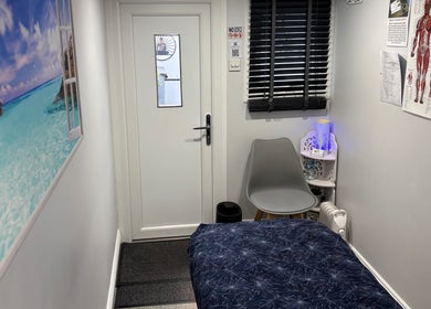 Cozy therapy room at J.F Muscle Medic, Stourbridge, England, GB features soothing decor and relaxation area.