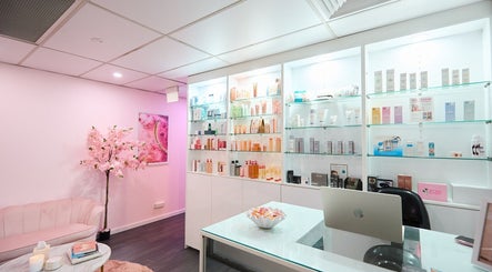 Beauty Circle reception in Sydney, New South Wales, AU with pink decor and skincare display.