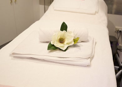 Spa bed with elegant white towels at Beauty Circle, Sydney, New South Wales, AU.