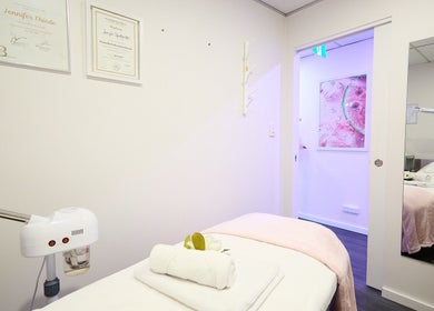 Tranquil spa room at Beauty Circle, Sydney, New South Wales, AU with cozy massage table and soothing decor.
