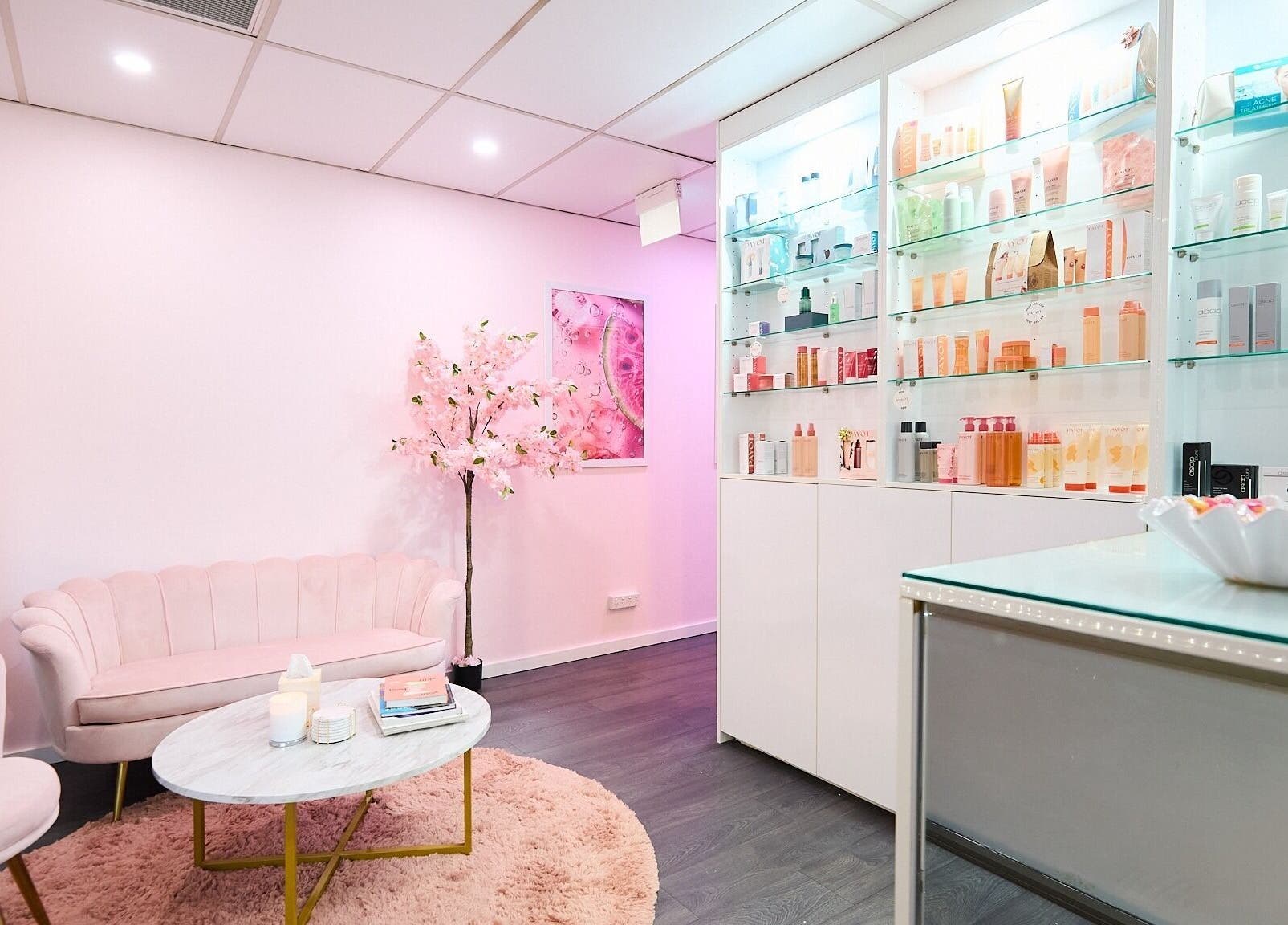 Elegant Beauty Circle lounge with pink decor and product display in Sydney, New South Wales, AU.