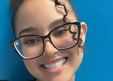 Smiling person with glasses at Key Touch, Woodbridge Township, New Jersey, US.