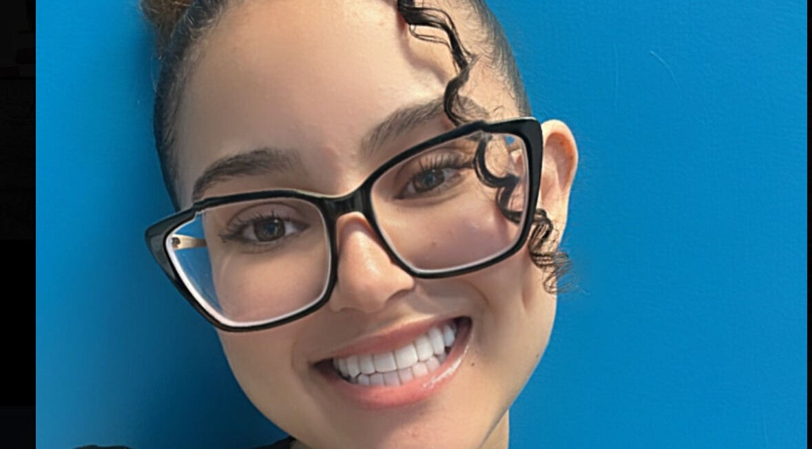Smiling person with glasses at Key Touch, Woodbridge Township, New Jersey, US.