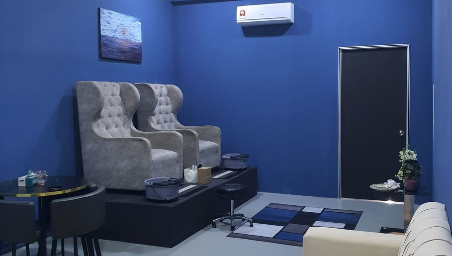 Luxsyr Spa's plush seating area in Johor Bahru, Johor, MY, featuring elegant wingback chairs.