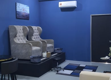 Luxsyr Spa's plush seating area in Johor Bahru, Johor, MY, featuring elegant wingback chairs.
