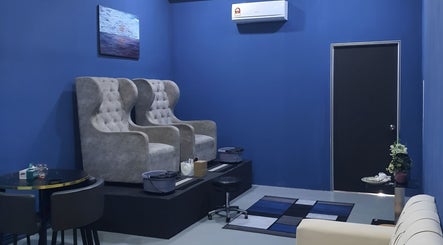 Luxsyr Spa's plush seating area in Johor Bahru, Johor, MY, featuring elegant wingback chairs.