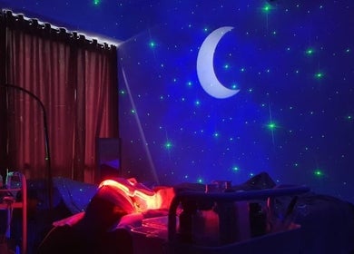 Luxsyr Spa in Johor Bahru offers tranquil treatments with celestial decor under a crescent moon and stars.