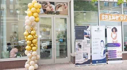 Entrance to 5751 Fishers Ln Unit D, Rockville, MD 20852 adorned with gold balloons, showcasing a wellness venue in Rockville, Maryland, US.