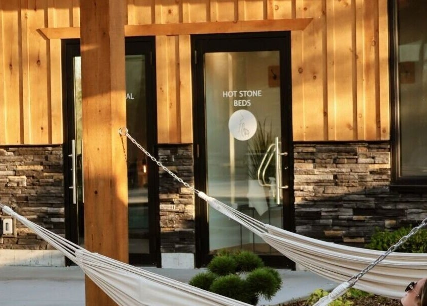 Relaxing hammock at Wave Nordic Spa, Mount Elgin, Ontario, CA, offering serene wellness experiences.