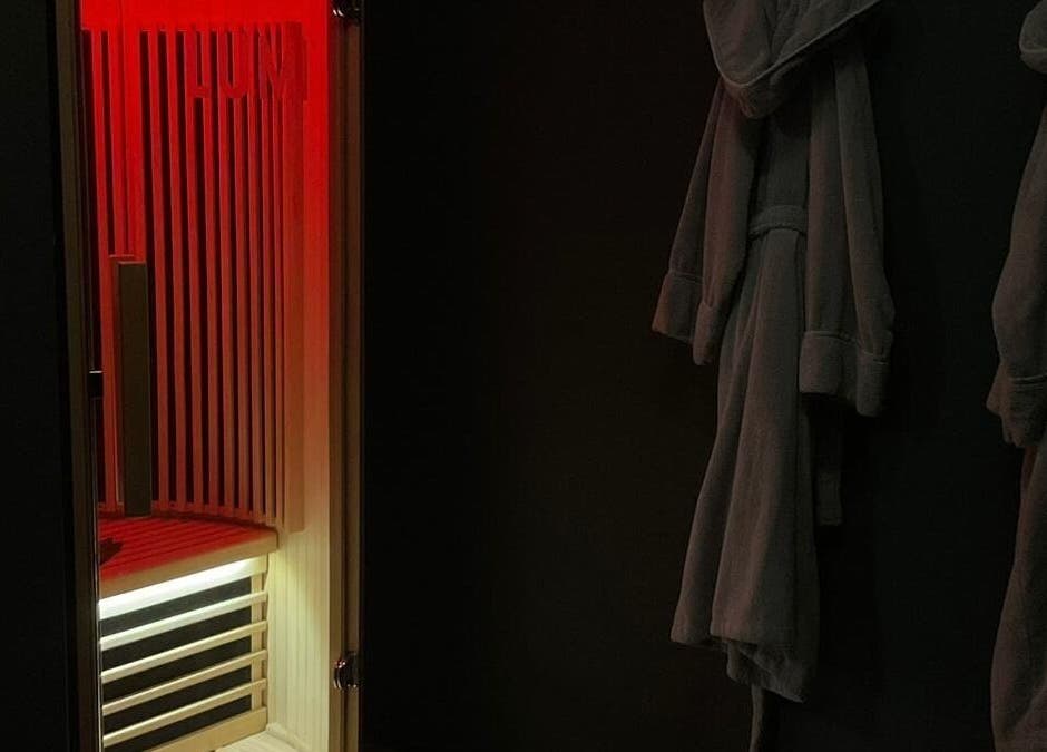 Cozy sauna interior at Wellness By Resolve in Birmingham, England, GB, offering relaxation in a luxurious setting.