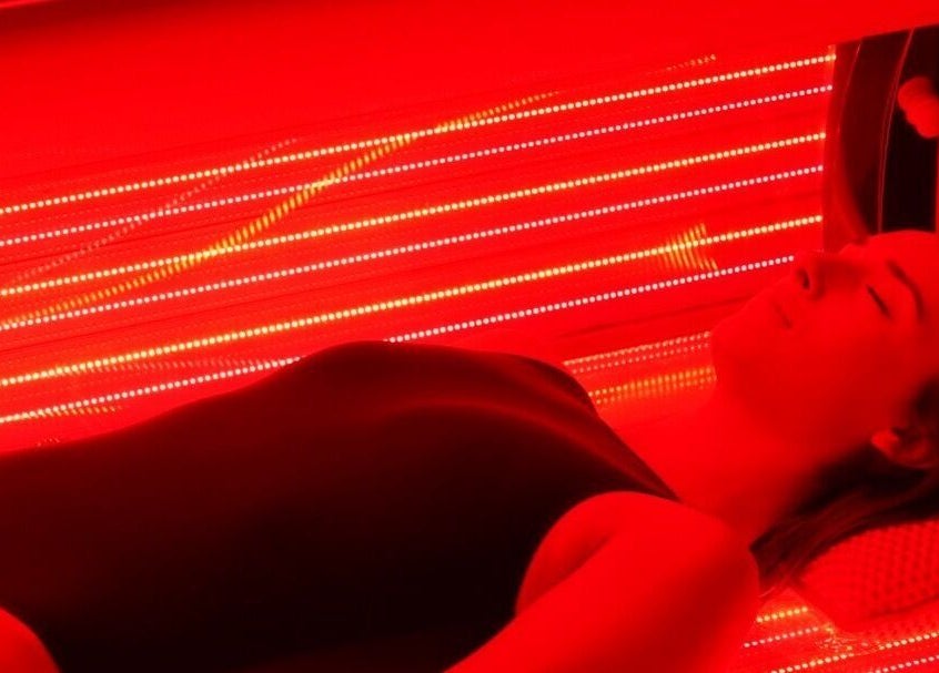 Woman enjoying red light therapy at Wellness By Resolve, Birmingham, England, GB.