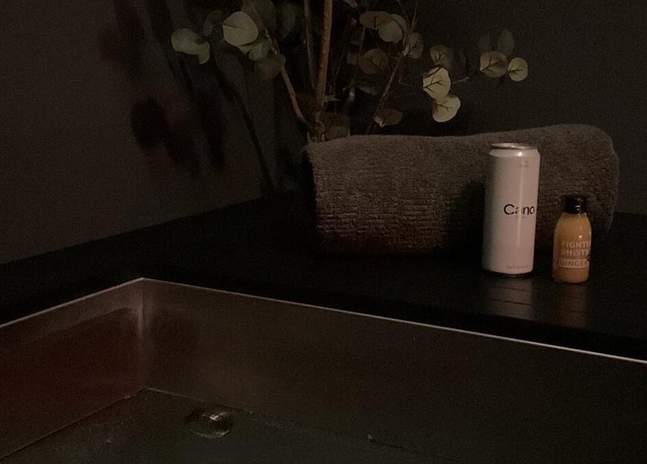 Luxury spa corner at Wellness By Resolve, Birmingham, England, GB with plush towel and refreshing drinks.