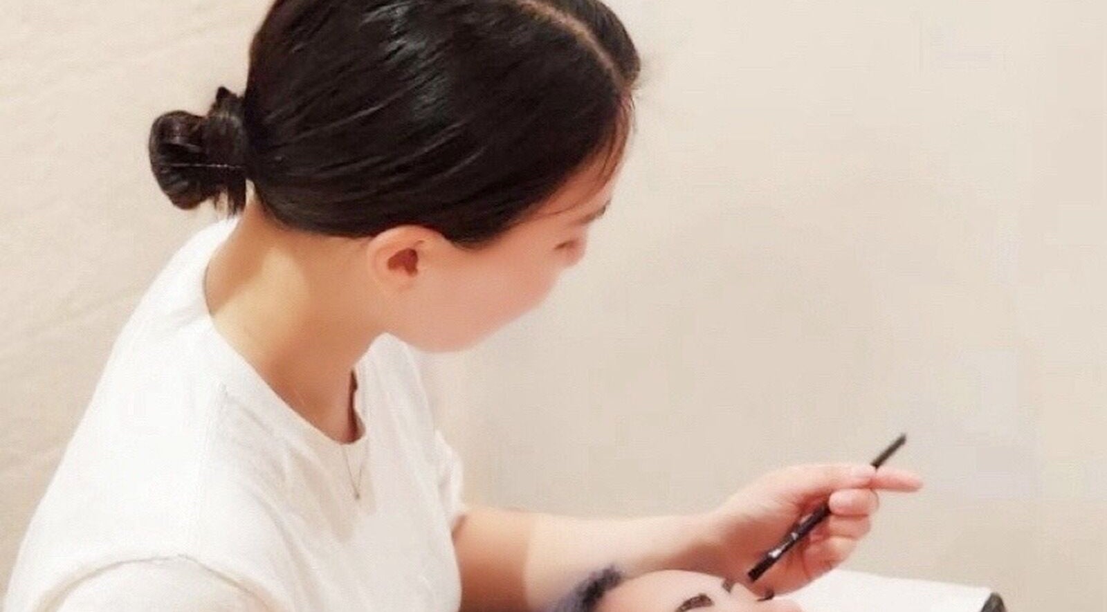 Technician crafting brows at Haruka Lashes and Brows Japanese Salon, Subiaco, Western Australia, AU.