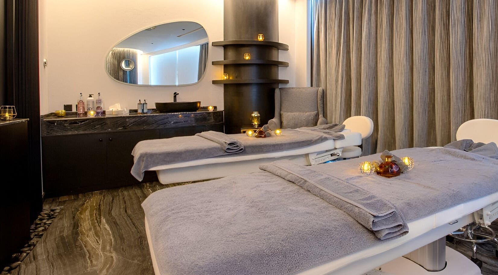 Relaxing massage room at Marina Stream Spa & Wellness, Lusail, Al Daayen Municipality, QA with soft lighting.