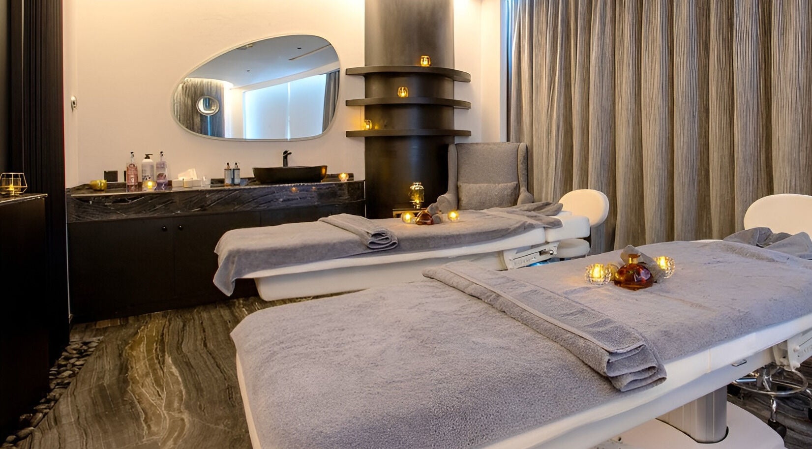 Relaxing massage room at Marina Stream Spa & Wellness, Lusail, Al Daayen Municipality, QA with soft lighting.