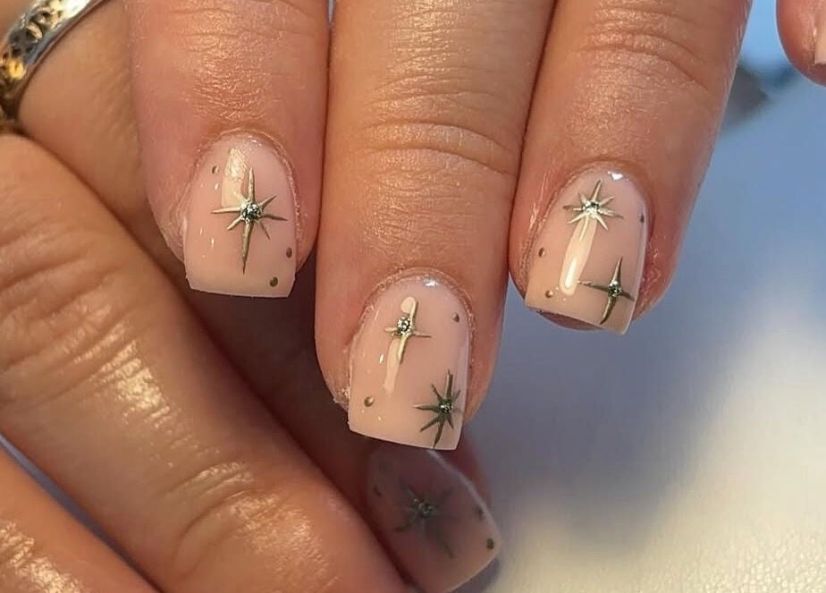 Elegant starry nail art at Beauty By Katie Davies in Neath, Wales, GB. Perfectly manicured hands.