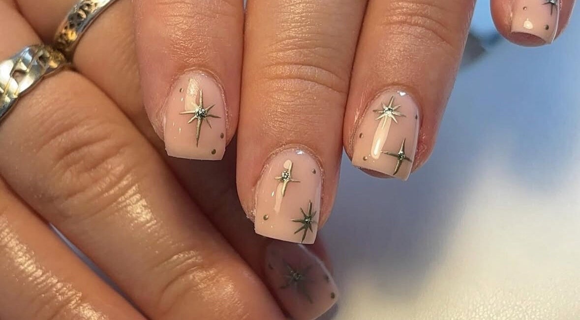 Elegant starry nail art at Beauty By Katie Davies in Neath, Wales, GB. Perfectly manicured hands.