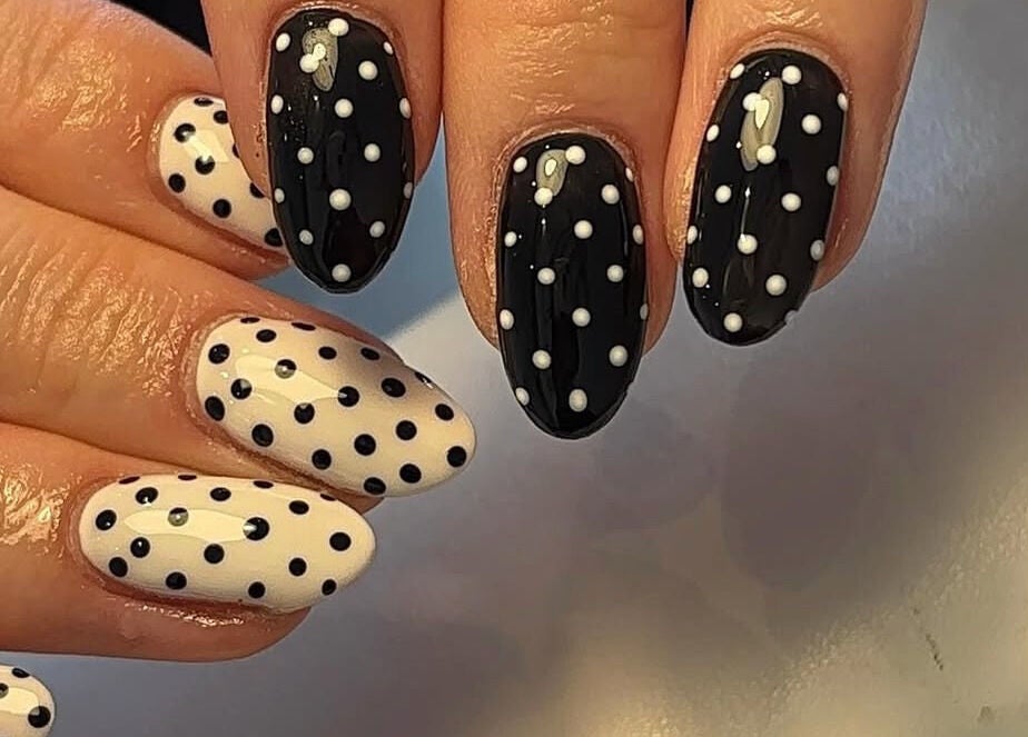 Elegant polka dot nail art at Beauty By Katie Davies in Neath, Wales, GB showcasing monochrome elegance.