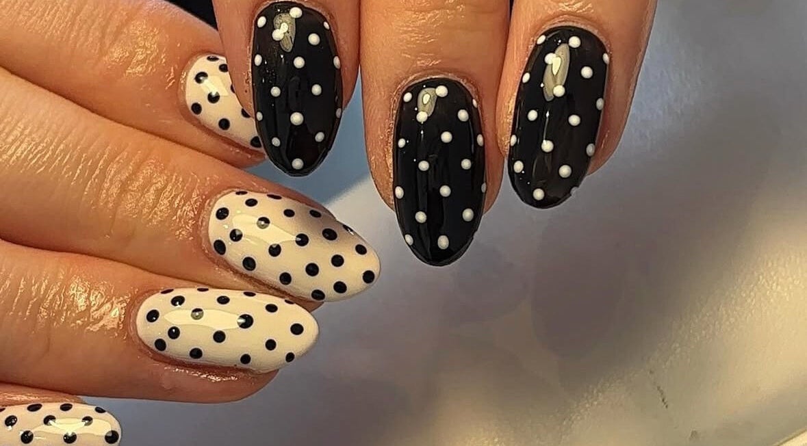 Elegant polka dot nail art at Beauty By Katie Davies in Neath, Wales, GB showcasing monochrome elegance.