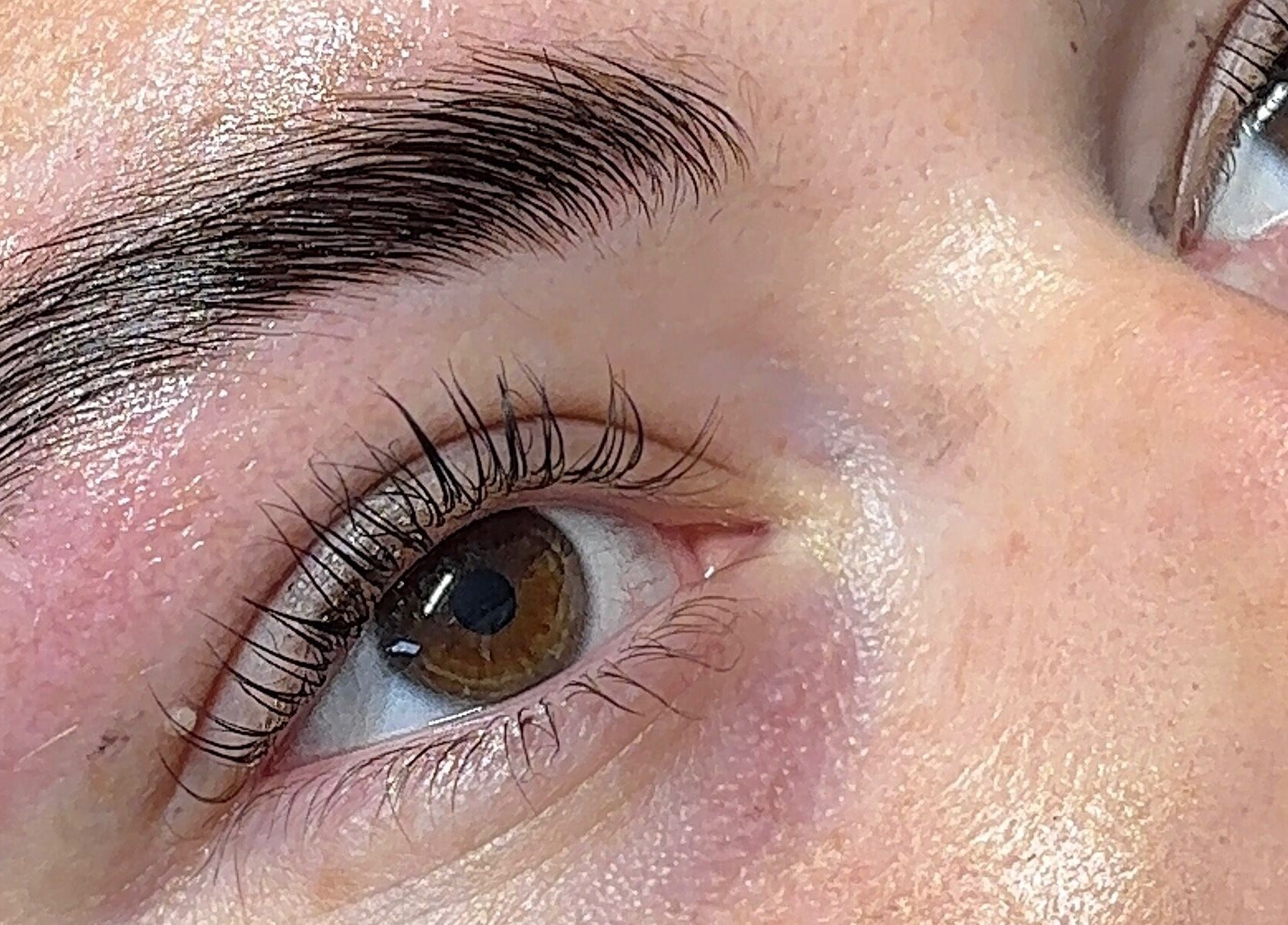 Close-up of beautifully enhanced lashes at Beauty By Katie Davies, Neath, Wales, GB showcasing expert eyebrow work.