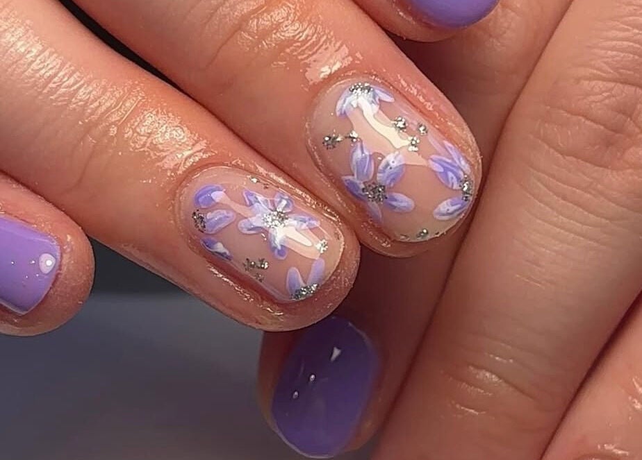 Elegant lavender nail art at Beauty By Katie Davies, Neath, Wales, GB showcases floral design and meticulous detailing.