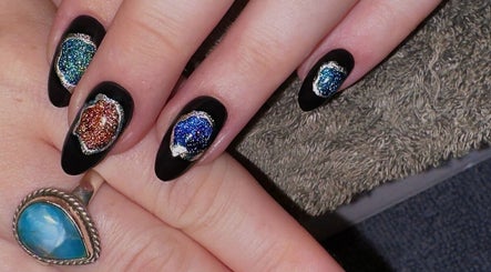 Colorful cosmic nail art at The Glow Standard Studio, Capreol, Ontario, CA, showcasing intricate designs.