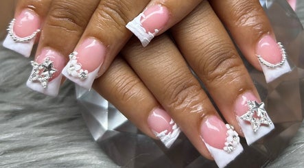 Chic star-themed nail art at PurpLust Nails, Hazelwood, Missouri, US.
